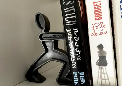 a pair of scissors sitting next to a book at Hôtel Paul in Aix-en-Provence