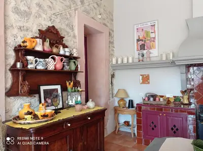 a room with a table with vases on it at La Maison de Maïté in Cheval-Blanc