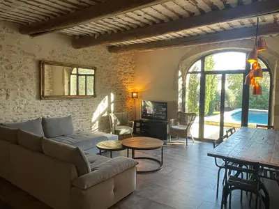 a living room with a couch and a table at Le Mas du Félibre in Caumont-sur-Durance