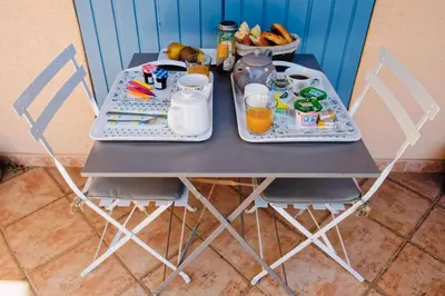 a table with two trays of food and drinks on it at Villa Louanne in Pertuis