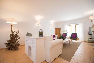 a living room with a white couch and a table at La Bastide des Bourguets Adults Only, Mont Ventoux in Sault-de-Vaucluse