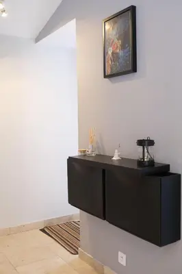 a room with a black counter and a picture on the wall at Nice house with private-pool situated in the heart of the Luberon in Maubec