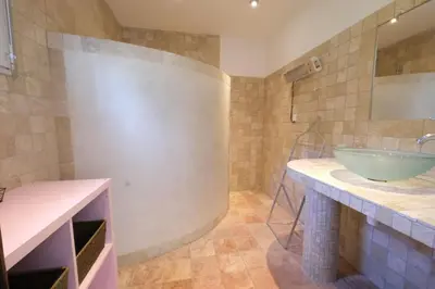 a bathroom with a sink and a mirror at Nice house with private-pool situated in the heart of the Luberon in Maubec