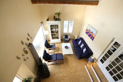 an overhead view of a living room with blue furniture at Very pleasant vacation rental with heated pool in the Luberon in Gargas