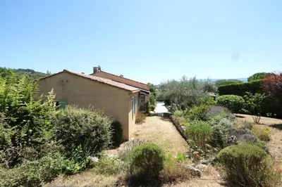 a house in the middle of a garden at Very pleasant vacation rental with heated pool in the Luberon in Gargas