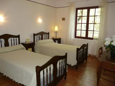 a bedroom with two beds and a window at Spacious villa on two levels in Cabrières-dʼAvignon