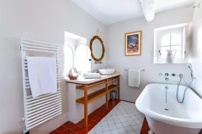 a white bathroom with a tub and a sink at Belle De Jour -A Provencal gem Private heated pool in Gordes