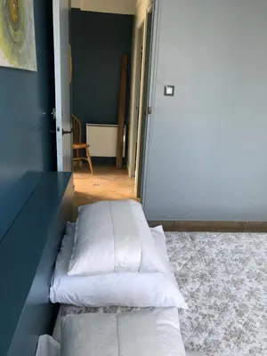 a room with two pillows on the floor next to a door at L'Atelier des Coudelières in Le Thor