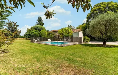 a house with a swimming pool in a yard at Cozy Home In Pernes Les Fontaines in Pernes-les-Fontaines