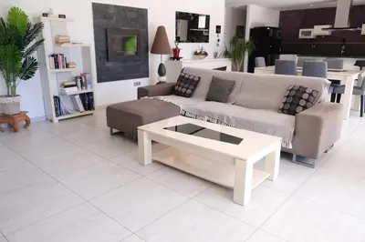 a living room with a couch and a coffee table at very pretty contemporary villa with pool located in Aureille in the alpilles, close to the center on foot. sleeps 4. in Aureille