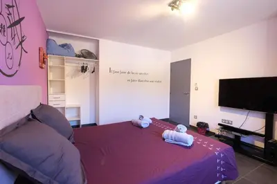 a bedroom with two stuffed animals on a bed at very pretty contemporary villa with pool located in Aureille in the alpilles, close to the center on foot. sleeps 4. in Aureille