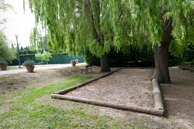 a park with a bench under a tree at VTF Les Florans in Bédoin