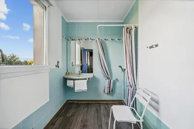 a bathroom with a sink and a mirror at Hôtel AKENA Chateaurenard - Parc des Expositions Avignon in Châteaurenard