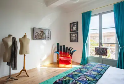 a bedroom with a bed and a window at Maison Du Collectionneur in Aix-en-Provence