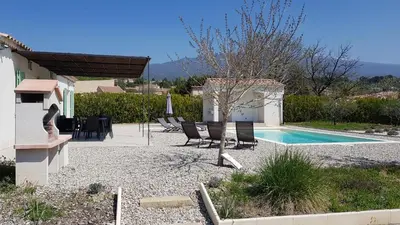 a villa with a swimming pool and a house at Villa Chapperon in Bédoin