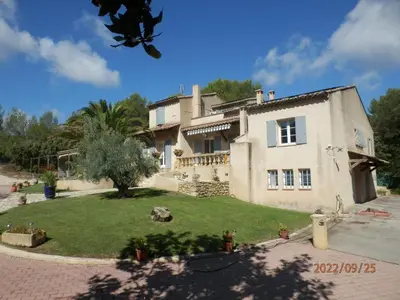 a large house with a yard in front of it at Gite Le city en Provence in Lambesc