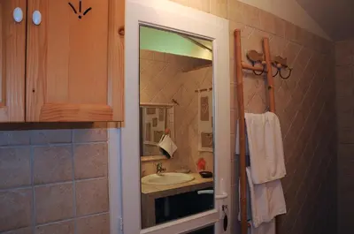 a bathroom with a sink and a mirror at un lit en provence in Éguilles