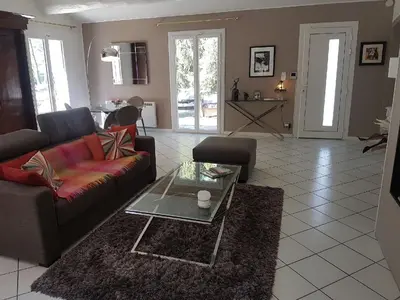 a living room with a couch and a coffee table at Détente champêtre in Lambesc