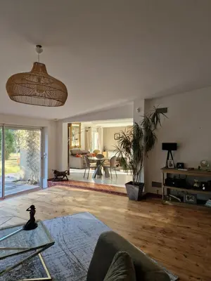 a living room with a couch and a table at Détente champêtre in Lambesc