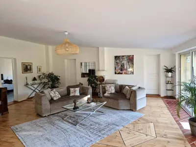 a living room with a couch and a table at Détente champêtre in Lambesc