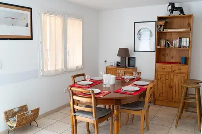 a dining room with a table and chairs at Gites Velaux Ecureuil et Pinède in Velaux