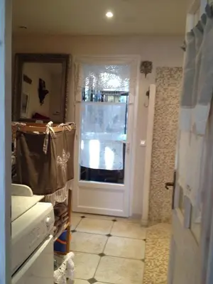 a room with a door with a window and a tile floor at L'Oustalet in La Tour-dʼAigues