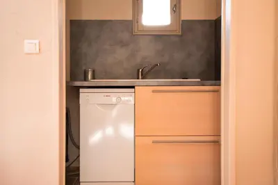 a kitchen with a sink and a dishwasher at A jewel by the river! in Fontaine-de-Vaucluse