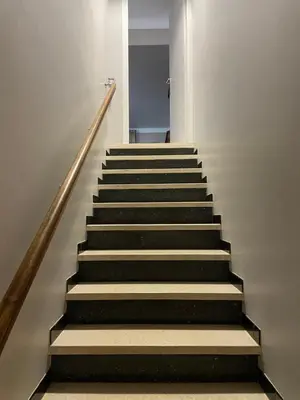 a stairway with a set of stairs in a building at La roseraie Bonnieux in Bonnieux