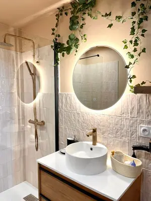 a bathroom with a sink and a mirror at Maison Florence Ivakno in Coudoux