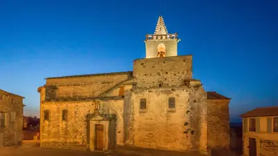 an old building with a tower on top of it at Les Terrasses de Cascavelle in Blauvac