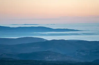 a view of a mountain range with clouds in the sky at Les Terrasses de Cascavelle in Blauvac