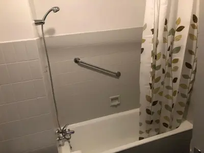 a shower in a bathroom with a shower curtain at Aix Homes in Aix-en-Provence