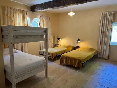 a bedroom with two bunk beds in a room at Villa in Saignon with Pool and Scenic Views in Ménerbes