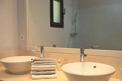 a bathroom with a white sink and a mirror at Mas De Gordes in Gordes