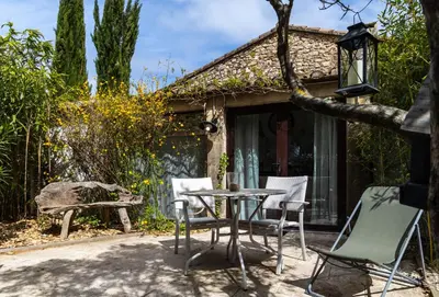 a living room with a couch and two chairs at Les Colombes in Lagnes