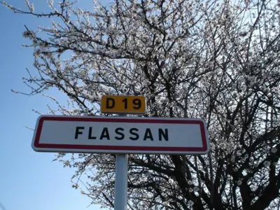 a street sign in front of a tree at Maison Charrasse in Flassan