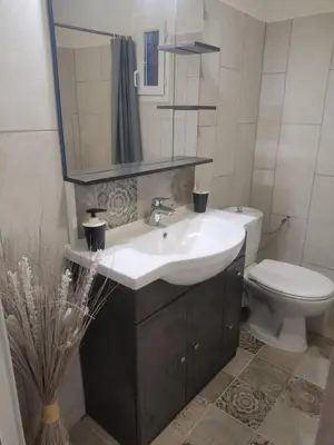 a bathroom with a sink and a toilet at Maisonnette in Carpentras
