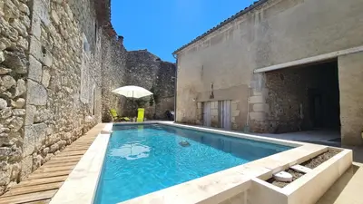 a swimming pool in the middle of a building at La maison Bleue in Céreste