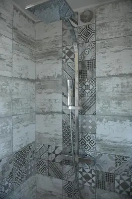 a shower with a glass door in a bathroom at Chambre d'hôtes du Charme Provençal in Sénas
