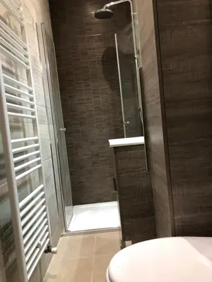 a shower with a glass door in a bathroom at Villa Les Cedres in Aix-en-Provence