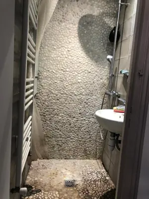 a small bathroom with a sink and a toilet at Villa Les Cedres in Aix-en-Provence