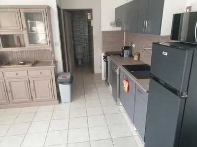 a kitchen with a refrigerator and a sink at Le Mas de la Tortue (Plain Pied) in Caromb
