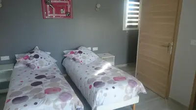 a bedroom with two beds with polka dots at Les Figues in Caromb