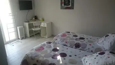 a bedroom with two beds with polka dot sheets at Les Figues in Caromb