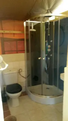 a bathroom with a shower and a toilet at Acacia in Mazan