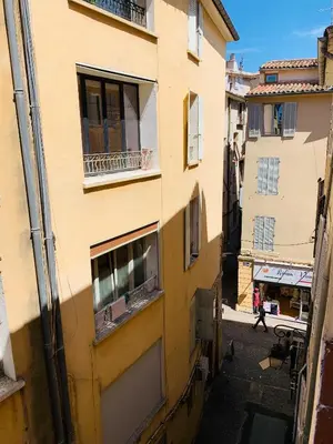 an alley between two buildings in a city at Granet Studio in Aix-en-Provence