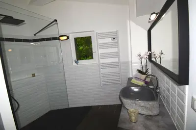 a bathroom with a shower with a sink and a window at Domaine Shambala - gîte en Provence avec une Grande Piscine in Velaux
