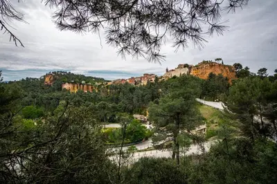 a view of a mountain with trees and rocks at Stunning panoramic views and heated pool in Roussillon in Roussillon