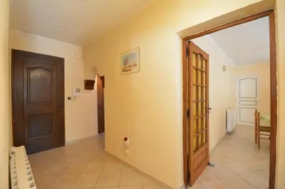 an empty hallway with a door and a room at Villa charmante à Saint-Didier avec piscine privée in Saint-Didier