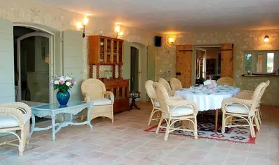 a dining room with a table and chairs at Le Mas Sérénité in Ansouis